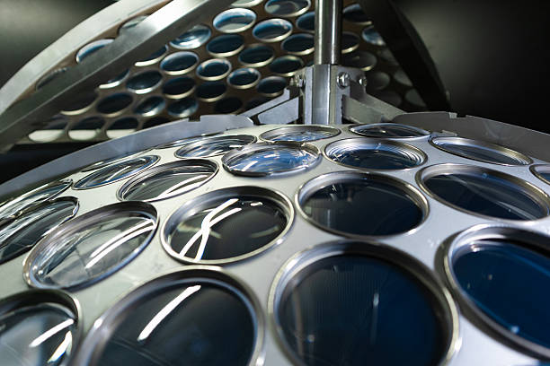 Circular optical elements mounted in a perforated processing holder